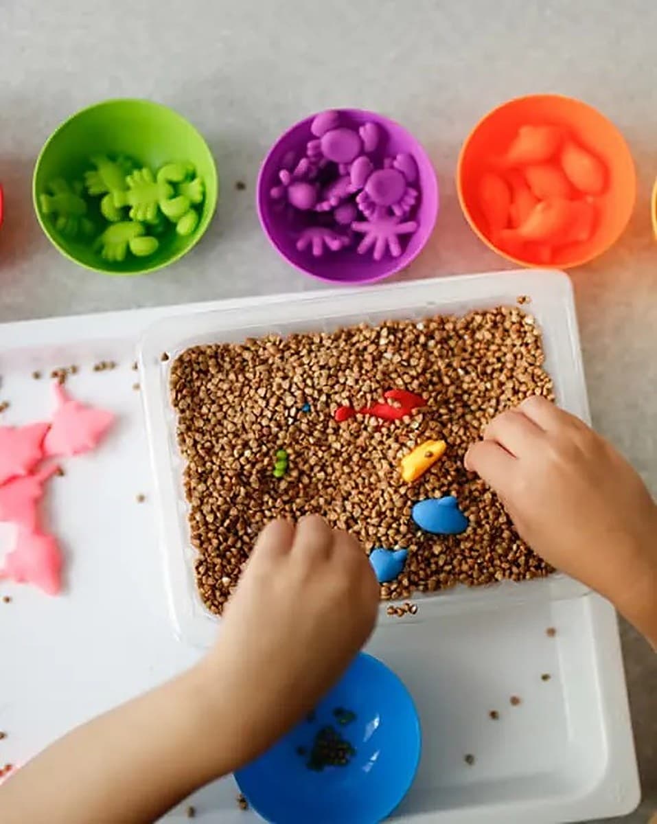 Baby exploring textures and toys during quiet play